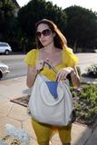 Angelina Jolie shows cleavage with yellow dress at restaurant in Hollywood